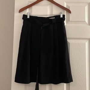 H&M black skirt with fabric belt. Size 6. Great condition!